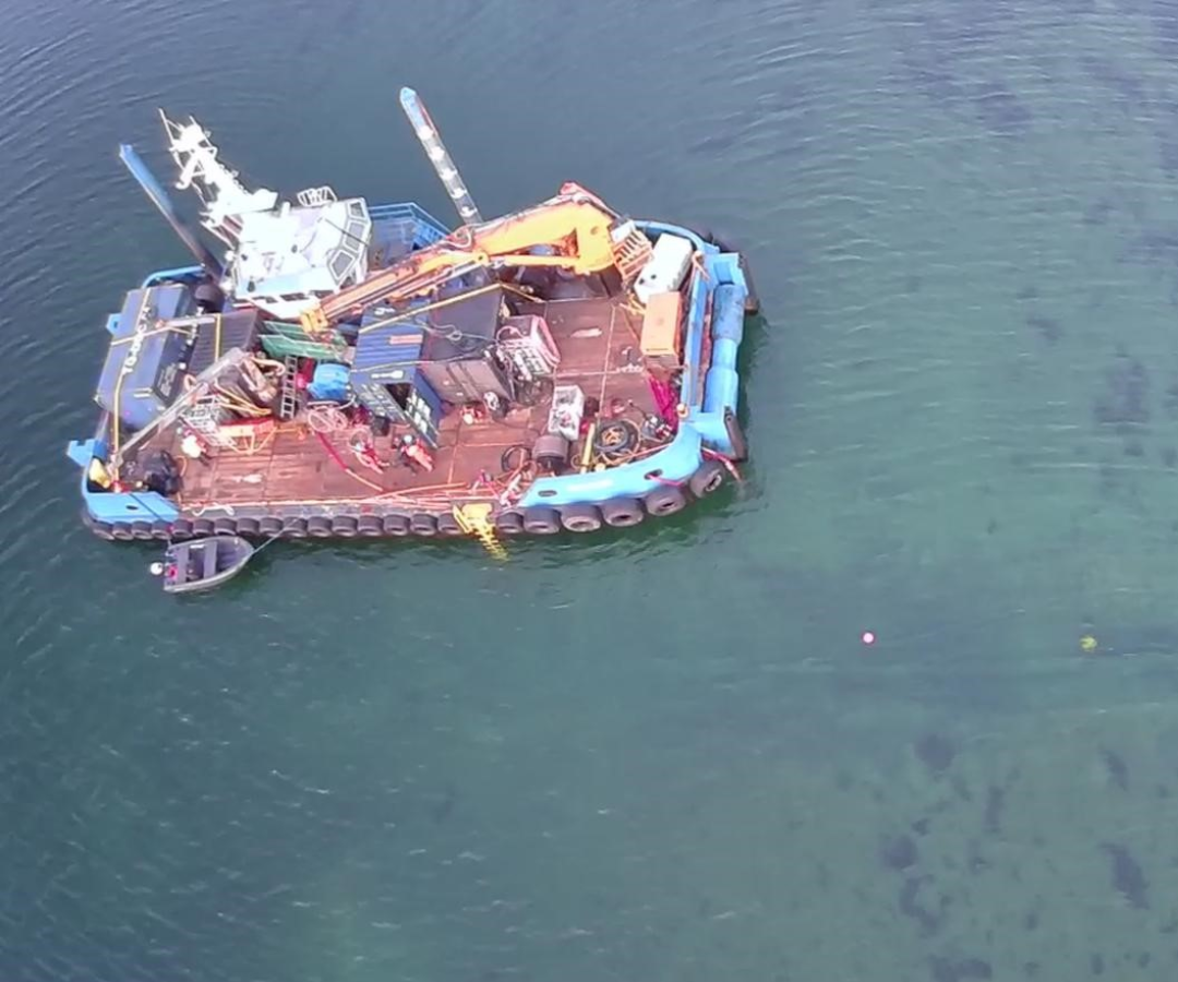 HDD exit support 2 An aerial view of a support vessel with markers in the sea.